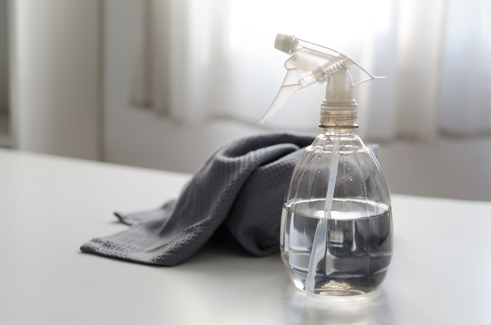 Spray bottle filled with pure water and vinegar